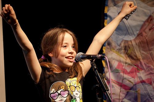 Girl cheering at public speaking competition